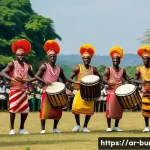 부룬디와 르완다의 문화 비교 - The Royal Drummers of Burundi in Performance:**
A vibrant and dynamic outdoor scene featuring the re...